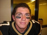 PLU football player Rich Isett with Matti written beneath his eyes